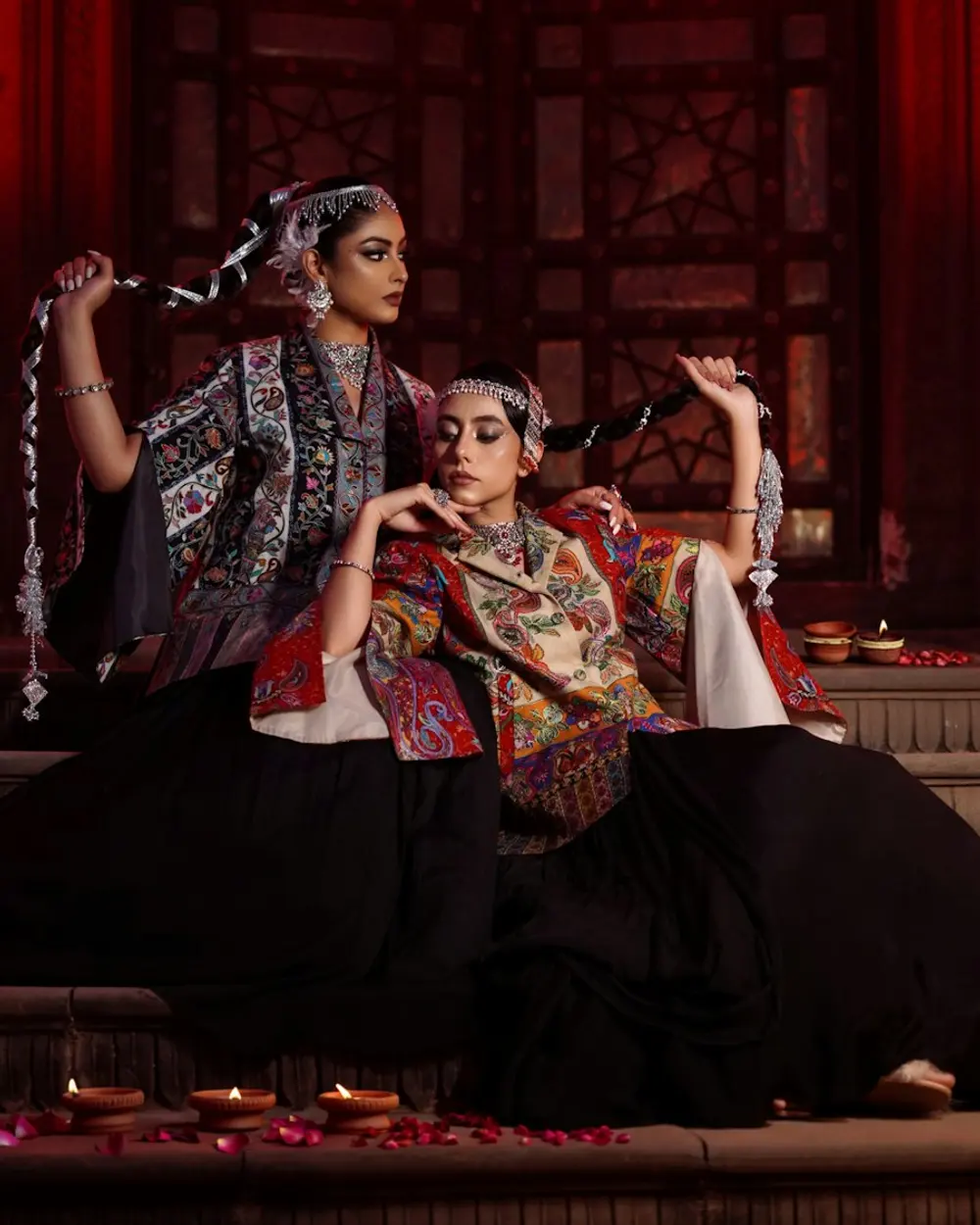 Two women in traditional embroidered outfits